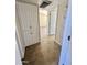 Hallway featuring a storage cabinet and doors leading to other rooms at 3645 N 71St Ave # 28, Phoenix, AZ 85033