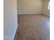 Living room featuring neutral walls and tile flooring creating a bright and airy space at 3645 N 71St Ave # 28, Phoenix, AZ 85033