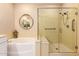 Bathroom with soaking tub and glass shower provides a relaxing retreat with elegant fixtures and finishes at 3910 N 163Rd Dr, Goodyear, AZ 85395