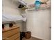 Organized walk-in closet with shelving, drawers, and ample storage space at 3910 N 163Rd Dr, Goodyear, AZ 85395