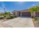 Attractive single-story home with desert landscaping and a long driveway at 3910 N 163Rd Dr, Goodyear, AZ 85395