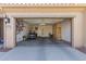 Spacious two-car garage with ample storage cabinets and room for a golf cart at 3910 N 163Rd Dr, Goodyear, AZ 85395