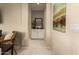 Hallway leading to an adjacent room showcases a decorative mirror and stylish wall art at 3910 N 163Rd Dr, Goodyear, AZ 85395