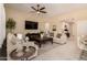 Comfortable living room featuring neutral tones, stylish furniture, and ample natural light at 3910 N 163Rd Dr, Goodyear, AZ 85395