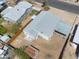 An aerial view of a well-maintained home featuring a spacious yard, a covered parking area, and a neatly fenced perimeter at 3925 E Arbor Ave, Mesa, AZ 85206