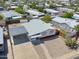Aerial view of the home showcasing the carport, driveway, and surrounding neighborhood at 3925 E Arbor Ave, Mesa, AZ 85206