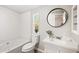 Clean bathroom featuring a white shower-tub combo, a toilet, and a sink with bright countertops at 3925 E Arbor Ave, Mesa, AZ 85206
