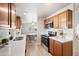 Modern kitchen with wood cabinets, a stainless steel oven, and bright countertops at 3925 E Arbor Ave, Mesa, AZ 85206