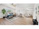 Open living room showcasing hardwood floors, a comfortable seating area, and bright natural light at 3925 E Arbor Ave, Mesa, AZ 85206