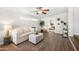 Comfortable living room with modern decor, wood floors, and lots of natural light at 3925 E Arbor Ave, Mesa, AZ 85206