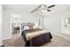 Cozy main bedroom showcasing neutral colored carpet, and bright natural light at 3925 E Arbor Ave, Mesa, AZ 85206
