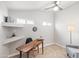 Bright office space featuring a wooden desk, carpeted flooring, and neutral walls at 3925 E Arbor Ave, Mesa, AZ 85206
