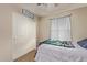 Clean bedroom with a ceiling fan, neutral walls, a comfortable bed, and closet at 3929 S 79Th Ln, Phoenix, AZ 85043