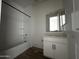 A bathroom with a tub, vanity, and a mirror at 4344 E Brook Lynn Pl, San Tan Valley, AZ 85140