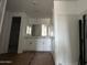 Bright bathroom features white cabinetry and a large mirror, offering a clean and modern aesthetic at 4344 E Brook Lynn Pl, San Tan Valley, AZ 85140