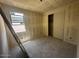 Bedroom with window view and closet, unfinished walls create a blank canvas for customization at 4344 E Brook Lynn Pl, San Tan Valley, AZ 85140