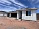 New house showing the covered porch, open garage and incomplete exterior insulation at 4344 E Brook Lynn Pl, San Tan Valley, AZ 85140