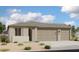 Charming single-story home featuring a neutral color palette, attached two-car garage, and low-maintenance landscaping at 4344 E Brook Lynn Pl, San Tan Valley, AZ 85140
