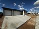 New construction home featuring a three-car garage and a concrete driveway at 4344 E Brook Lynn Pl, San Tan Valley, AZ 85140