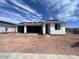 New construction home with an open garage and covered porch, still in the process of being completed at 4344 E Brook Lynn Pl, San Tan Valley, AZ 85140