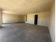 Spacious unfinished garage with ample room for parking and storage solutions at 4344 E Brook Lynn Pl, San Tan Valley, AZ 85140