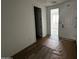 An interior view of a hallway featuring tile floors and white walls at 4344 E Brook Lynn Pl, San Tan Valley, AZ 85140