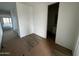 An interior view of a hallway featuring tile floors and white walls at 4344 E Brook Lynn Pl, San Tan Valley, AZ 85140
