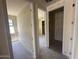 Hallway with doorways leading to other rooms, unfinished walls, awaiting personalization and final touches at 4344 E Brook Lynn Pl, San Tan Valley, AZ 85140