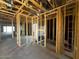 Interior framing of new construction shows open floor plan with visible plumbing and electrical lines at 4344 E Brook Lynn Pl, San Tan Valley, AZ 85140