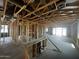 New home shows the framing with open ceiling, and exposed beams and ductwork at 4344 E Brook Lynn Pl, San Tan Valley, AZ 85140