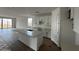 A bright kitchen featuring an island and white cabinets at 4344 E Brook Lynn Pl, San Tan Valley, AZ 85140