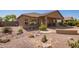 Desert landscaped backyard with covered patio and desert plants at 464 W Bismark St, San Tan Valley, AZ 85143