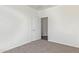 Neutral bedroom features an open door to another room at 464 W Bismark St, San Tan Valley, AZ 85143
