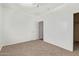 Bedroom with neutral carpet, a ceiling fan, and a door to another room at 464 W Bismark St, San Tan Valley, AZ 85143