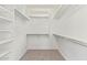 Walk-in closet with multiple shelving and rods, offering ample storage solutions at 464 W Bismark St, San Tan Valley, AZ 85143