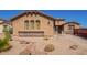Charming single-story home featuring a desert landscaped front yard and a warm, stucco exterior at 464 W Bismark St, San Tan Valley, AZ 85143