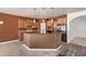 Well-equipped kitchen with granite countertops, wood cabinets, and stainless steel appliances at 464 W Bismark St, San Tan Valley, AZ 85143