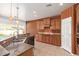 Well-equipped kitchen featuring granite countertops, wood cabinets, and stainless steel appliances at 464 W Bismark St, San Tan Valley, AZ 85143