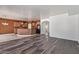Open-concept living space showing living room with laminate wood floors flowing into the kitchen at 464 W Bismark St, San Tan Valley, AZ 85143