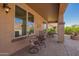 Covered patio with outdoor seating and desert views at 464 W Bismark St, San Tan Valley, AZ 85143