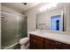 This bathroom offers a frosted glass shower, modern vanity, and ample lighting at 510 E Fremont Dr, Tempe, AZ 85282