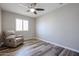 Neutral bedroom featuring wood-look floors, plantation shutters and ceiling fan at 510 E Fremont Dr, Tempe, AZ 85282