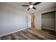 Neutral bedroom featuring wood-look floors and a ceiling fan and closet at 510 E Fremont Dr, Tempe, AZ 85282
