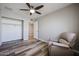 Neutral bedroom featuring wood-look floors, a ceiling fan and walk-in closet at 510 E Fremont Dr, Tempe, AZ 85282