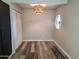 Dining room with wood floors, closet, custom window and modern lighting fixture at 510 E Fremont Dr, Tempe, AZ 85282