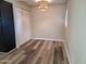 Charming dining area with wood-style flooring, closet, and a unique window at 510 E Fremont Dr, Tempe, AZ 85282
