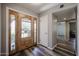 Bright foyer with wood-look floors, a decorative glass front door, and a coat closet at 510 E Fremont Dr, Tempe, AZ 85282