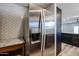 Stainless steel refrigerator with water dispenser and subway tile backsplash at 510 E Fremont Dr, Tempe, AZ 85282
