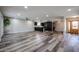 Open-concept living room and kitchen with modern floors and plenty of natural light at 510 E Fremont Dr, Tempe, AZ 85282