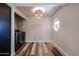 Room with stained wood floor, octagon stained glass window, and decorative light fixture at 510 E Fremont Dr, Tempe, AZ 85282